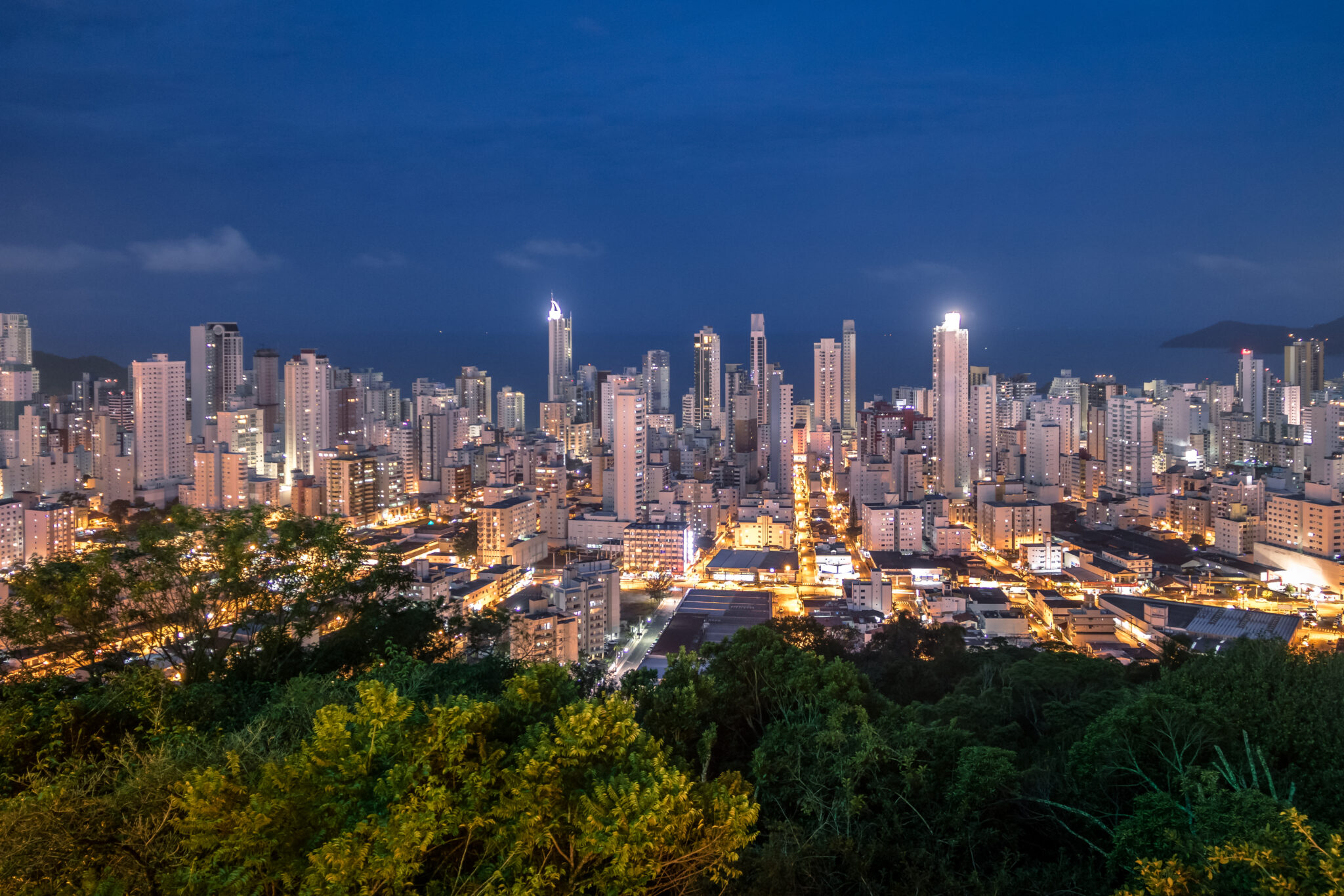 Aerial view of buildings in Balneario Camboriu city at night - Balneario Camboriu, Santa Catarina, Brazil